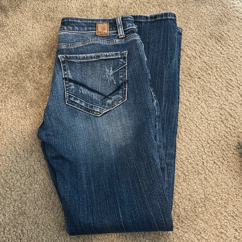 BKE denim skinny jeans with ripped fronts.